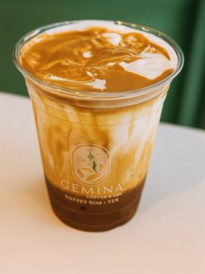 Iced caramel coffee in a Gemina branded cup